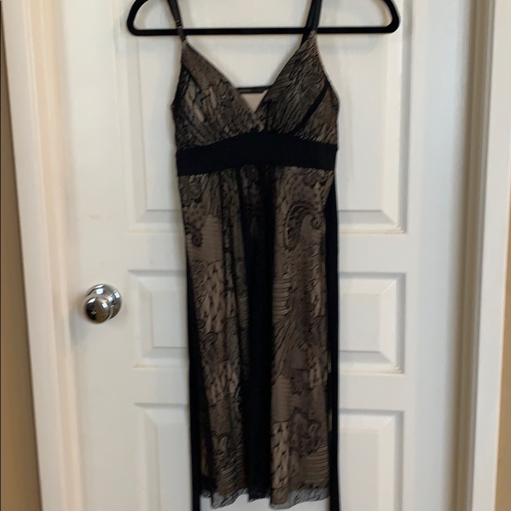 Knee length black dress.